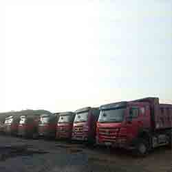YONAB CONSTRUCTION - Dump Trucks Parallel parked & ready for task